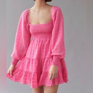 Pink smocked tiered mini dress. Woven pink checkered pattern